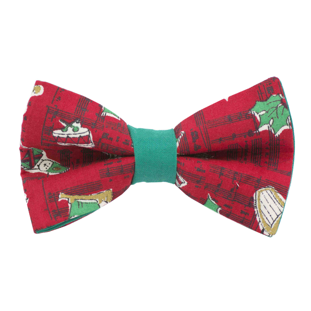 Noeud papillon "Christmas Song" notes de musique, tambour et houx sur fond rouge